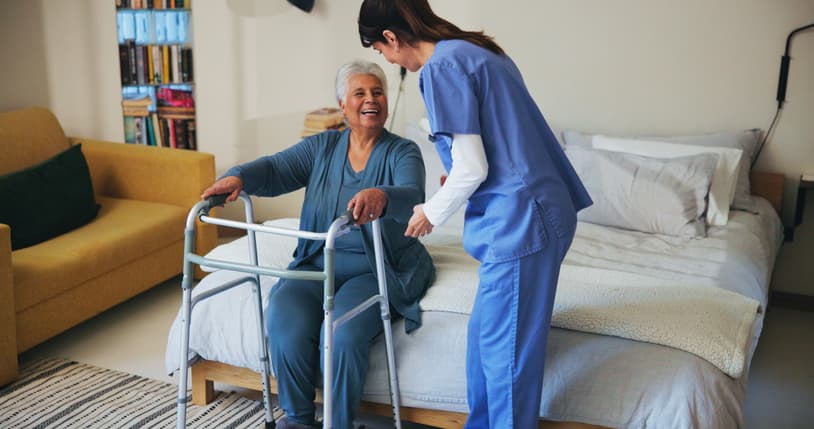 Senior care professional helping an elderly person
